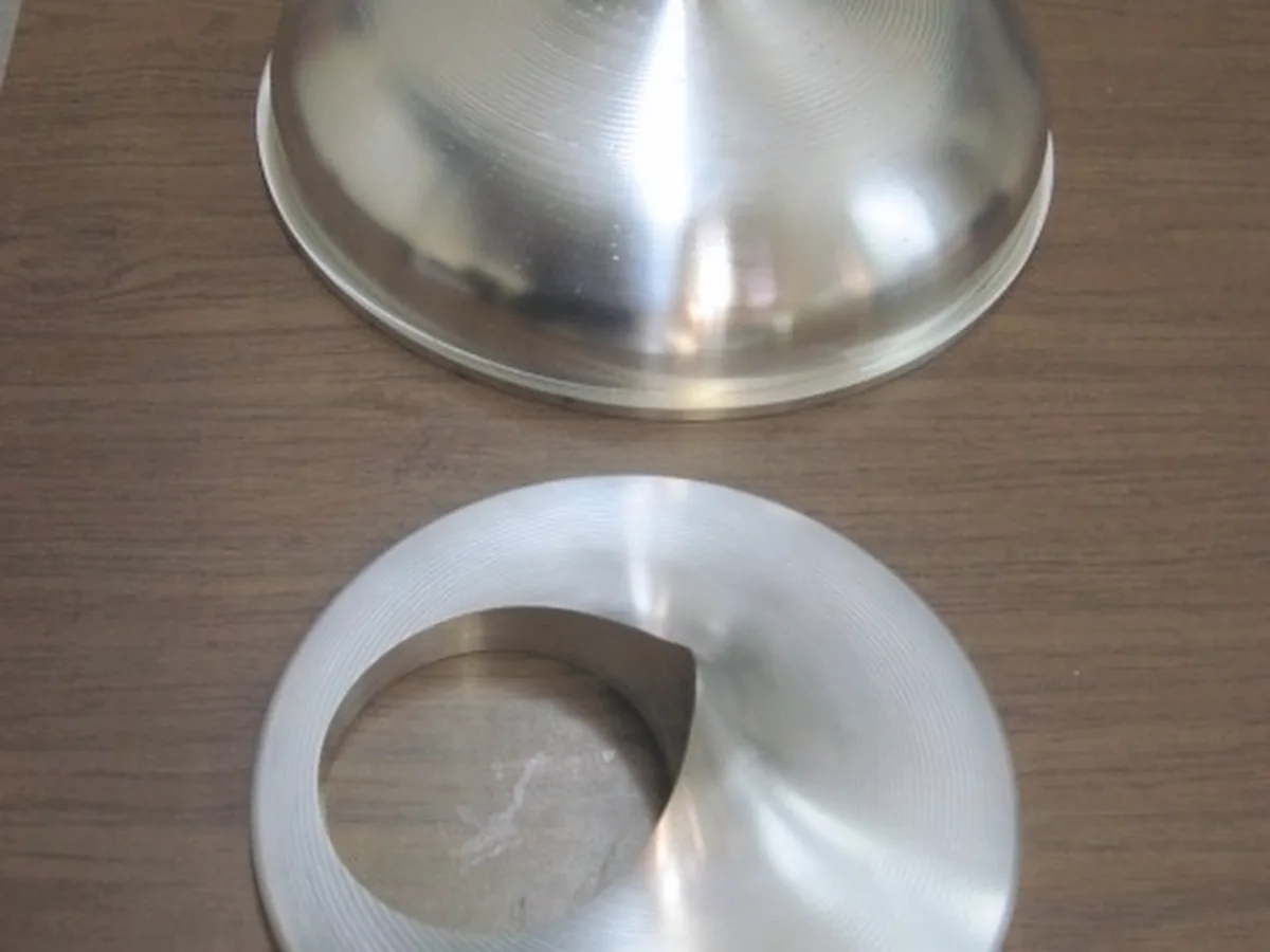 Turned aluminum bell form with a matching conical ring