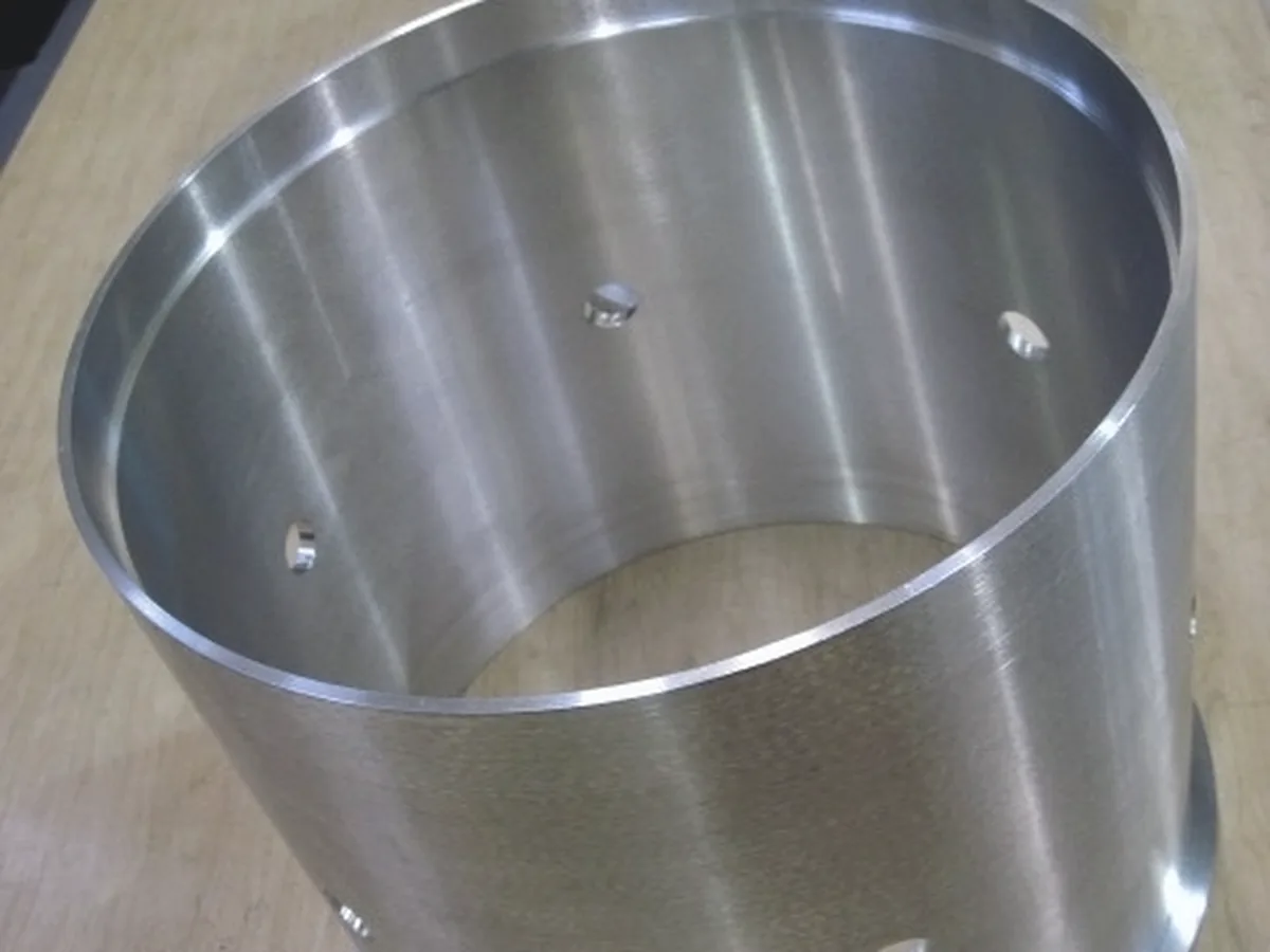 Large thin-wall aluminum cylinder with drilled side holes