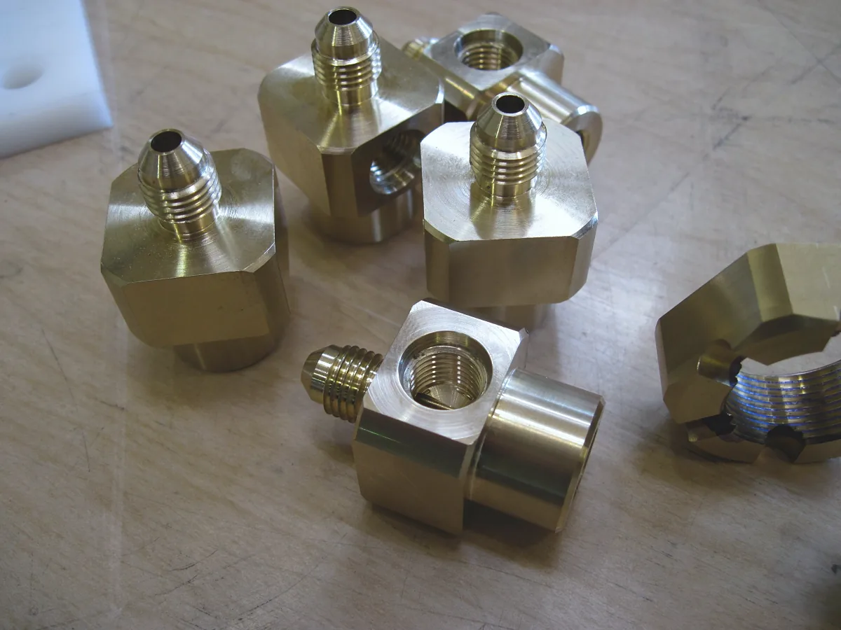 Brass flare fittings with hex bodies and threaded ports