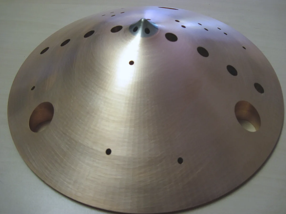 Machined dome with a ring of ports and a central cone