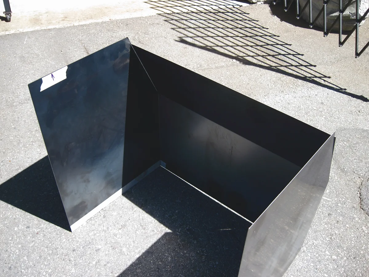 Folded and welded sheet-metal enclosure