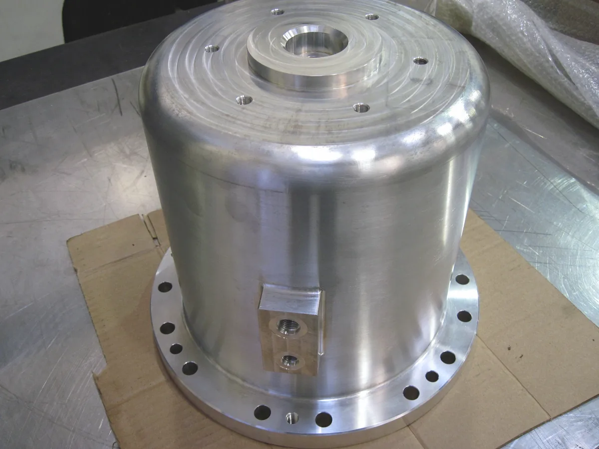 Large aluminum cylindrical housing with a bolted flange and side port