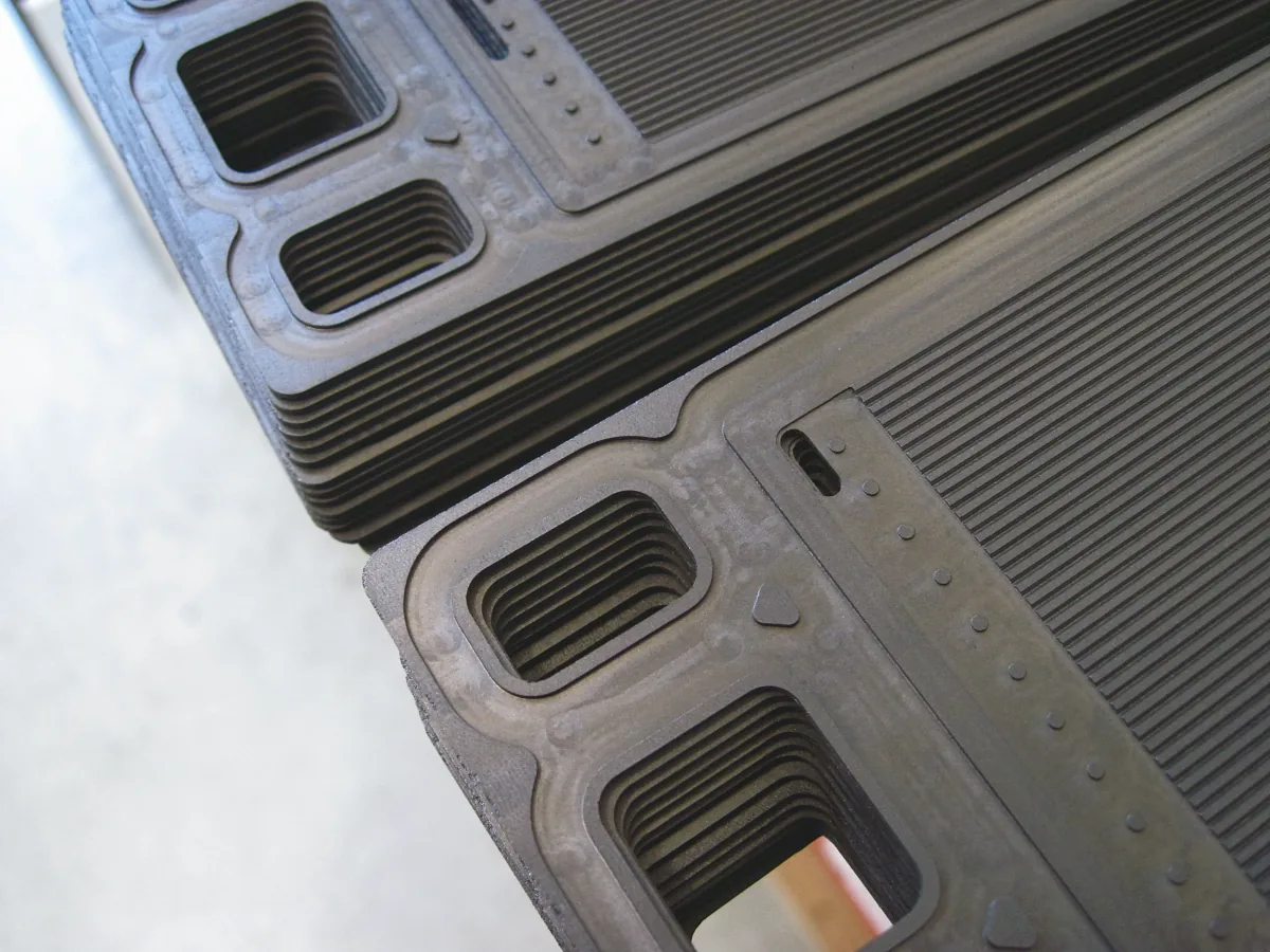 Stacked plates with machined flow-field channels and ports